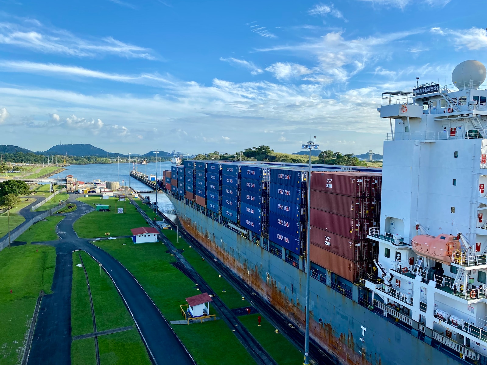 A Large Cargo Ship In A Body Of Water From Panama Canal In Panama